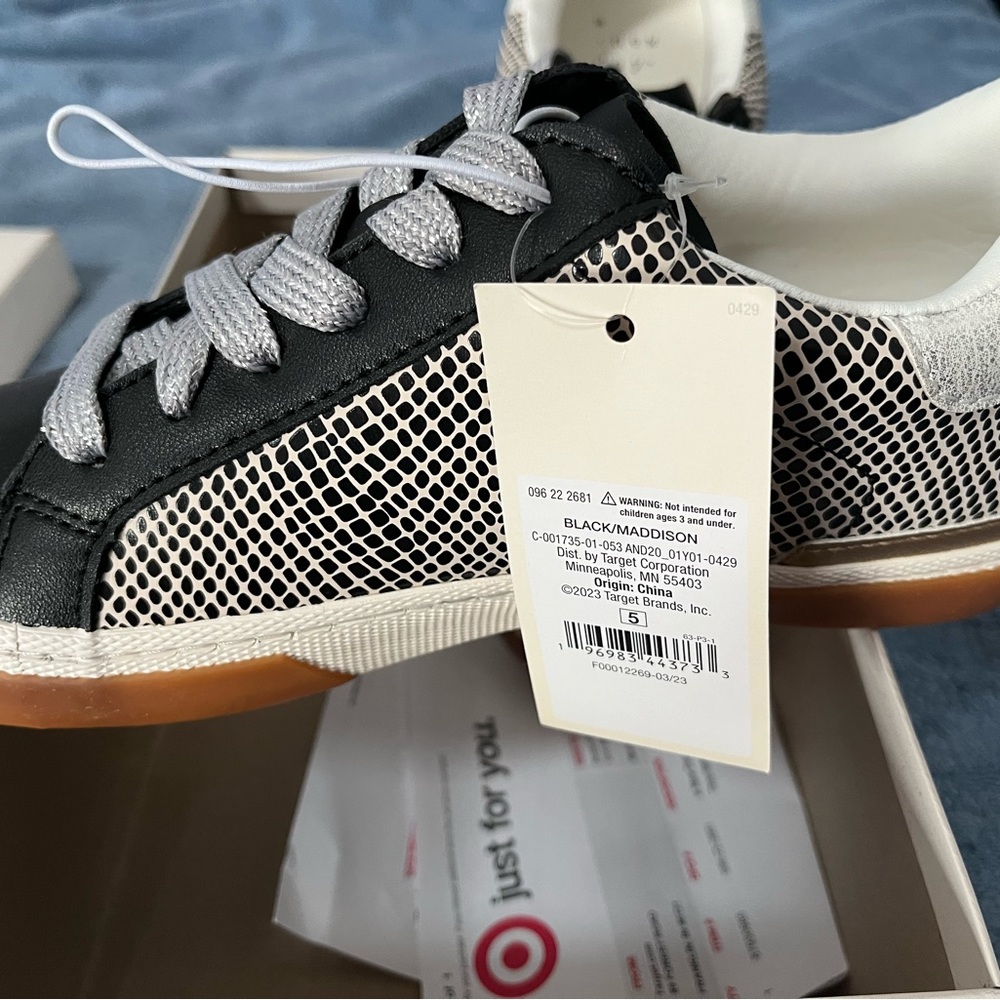 Women’s fashion sneakers.   Black and white with silver laces.   Size 5